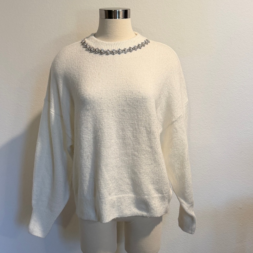 Elegant White Sweater with Embellished Neckline